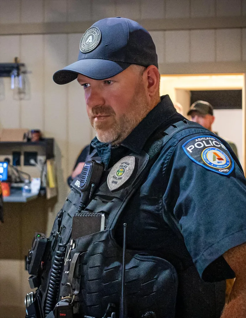 Officer wearing an Ashland Police patch at Hot Shots